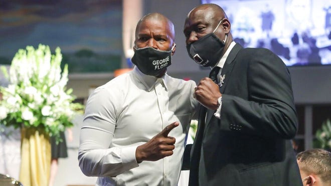 Civil rights attorney Ben Crump poses for a picture with actor Jamie Foxx following George Floyd's funeral on June 9 at The Fountain of Praise church in Houston.  Floyd died after being arrested by Minneapolis police on May 25.