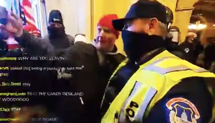 Capitol Police Member Caught on Camera Taking Selfies With Trump's Insurrectionists