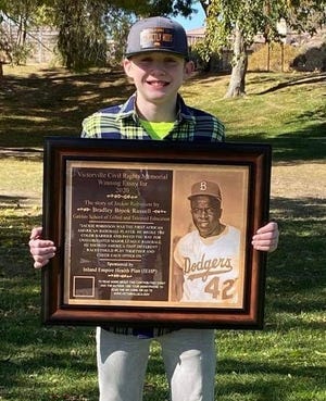 Bradley Brook Russell's winning essay inspired the Jackie Robinson plaque, which honors the legend of the Brooklyn Dodgers who broke the color barrier of Major League Baseball.