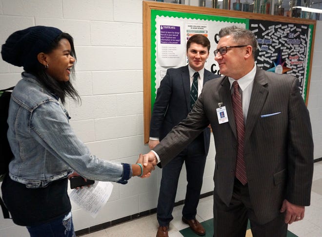Birmingham Public Schools Superintendent Mark Dziatczak greets freshman Gabrielle Lack in the hallway of Birmingham Groves High on January 24, 2019.  Dziatczak submitted his resignation to the school board this month after having been on vacation for several months.