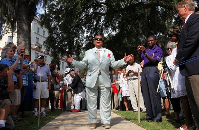 Andrew Young speaks as he walks over a sidewalk memorial commemorating the St. Augustine Civil Rights March on June 9, 1964 during the inauguration in Plaza de la Constitucion on Saturday, June 11, 2011.