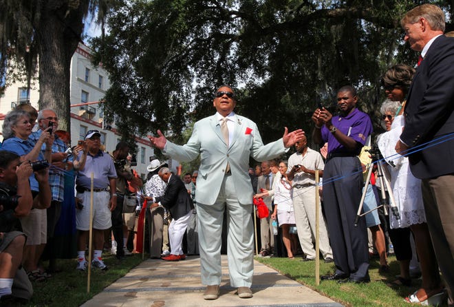 Andrew Young speaks as he walks over a sidewalk memorial commemorating the St. Augustine Civil Rights March on June 9, 1964 during the inauguration in Plaza de la Constitucion on Saturday, June 11, 2011.
