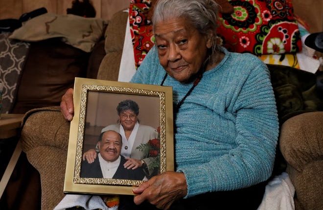 Alice Saunders holds a photo of herself and her husband Kenneth from her 50th wedding anniversary celebration. Alice turned 95 in 2020, and has been a civil rights leader in the area since the 1950s.