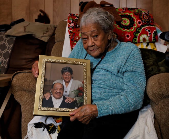 Alice Saunders holds a photo of herself and her husband Kenneth from her 50th wedding anniversary celebration. Alice turned 95 in 2020, and has been a civil rights leader in the area since the 1950s.
