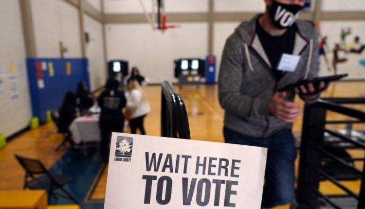 Civil rights groups sue Georgia over voting law