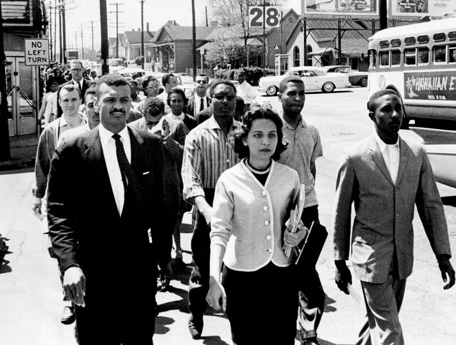 On the day activist Z. Alexander Looby's house was bombed, a group of 3,000 protesters led a group of 3,000 protesters down Jefferson Street towards City Hall.  In the front row are Rev. CT Vivian (left), Diane Nash from Fisk, and Bernard Lafayette from American Baptist Seminary.  In the second row are Kenneth Frazier and Curtis Murphy from Tennessee A & I and Rodney Powell from Meharry.