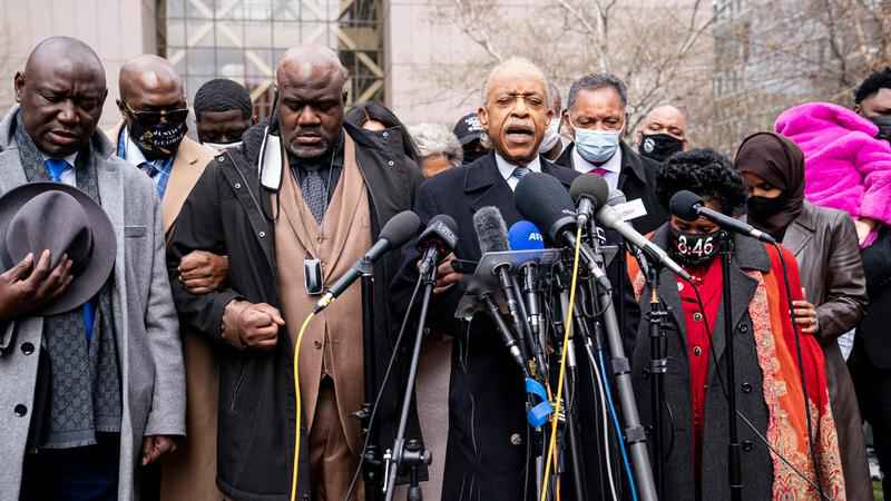 Rev. Al Sharpton, center right, leads a prayer alongside Rodney Floyd, brother of George Floyd, center left, during a news conference outside the Hennepin County Government Center before the murder trial against the former Minneapolis police officer Derek Chauvin in the killing of George Floyd advances to jury deliberations, Monday, April 19, 2021, in Minneapolis.