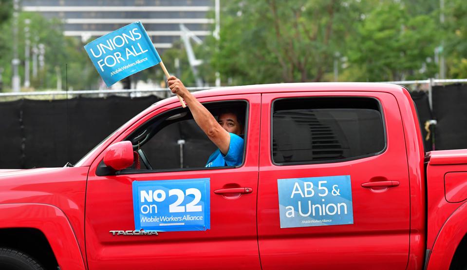 Some union-backed California rideshare drivers protested staying independent contractors.