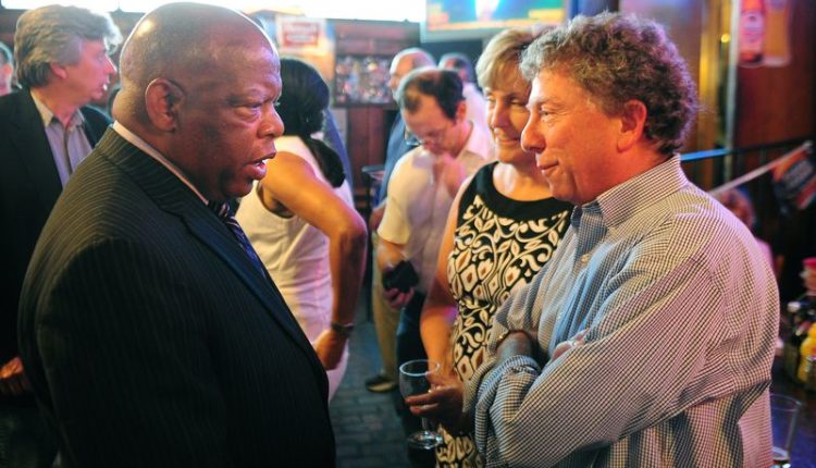 Former AJC Managing Editor Hank Klibanoff (right) chats with late U.S. Rep. John Lewis in 2008. Klibanoff said conversations with Lewis helped spur his interest in cold civil rights cases. Pouya Dianat/AJC