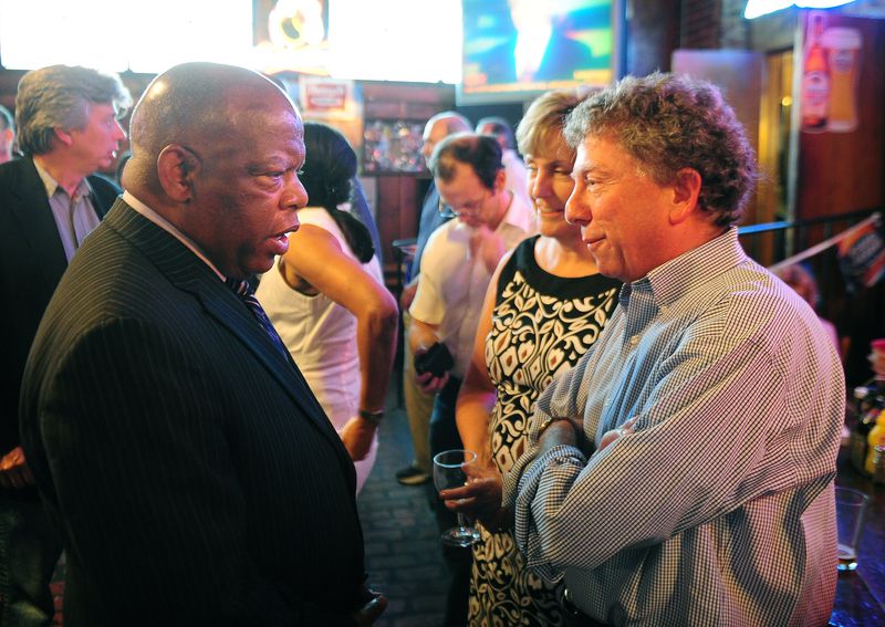 Former AJC Managing Editor Hank Klibanoff (right) chats with late U.S. Rep. John Lewis in 2008. Klibanoff said conversations with Lewis helped spur his interest in cold civil rights cases. Pouya Dianat/AJC