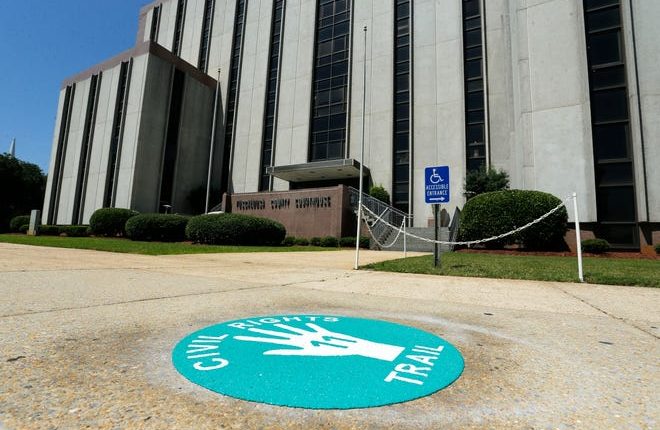 Markings for the Tuscaloosa Civil Rights Trail can be seen in downtown on Friday, July 5, 2019.  There are 18 locations on the trail with large green handprint markings.  Marker No.  located in front of the Tuscaloosa County Courthouse. [Staff Photo/Gary Cosby Jr.]