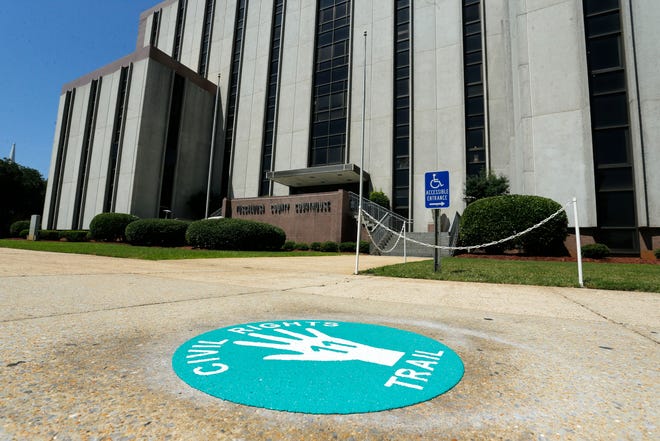 Markings for the Tuscaloosa Civil Rights Trail can be seen in downtown on Friday, July 5, 2019.  There are 18 locations on the trail with large green handprint markings.  Marker No.  located in front of the Tuscaloosa County Courthouse. [Staff Photo/Gary Cosby Jr.]