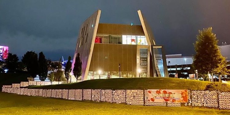Five thousand broken hearts, representing Georgians who have lost their lives to COVID-19, form the  “Loved Ones, Not Numbers Memorial Wall” around the National Center for Civil and Human Rights in Atlanta.