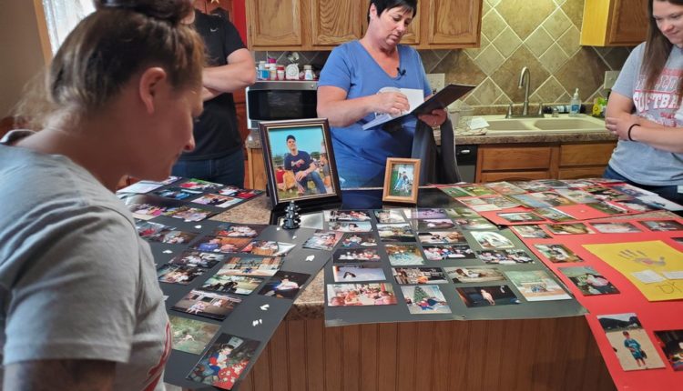 Tracy Bausch flips through photos of her son Dylan